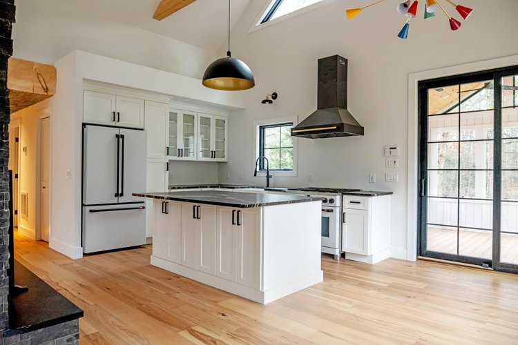 There is a large island in the middle of the kitchen.