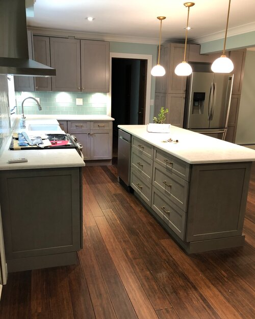 A kitchen with a large island in the middle of it