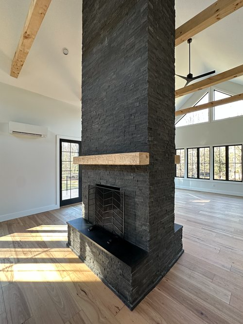 There is a fireplace in the middle of the room.