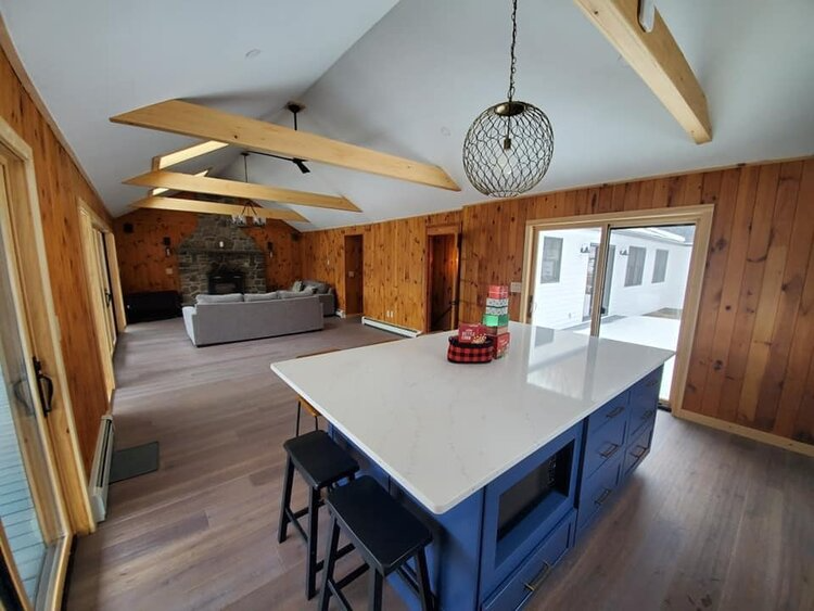 A kitchen with a large island in the middle of the room.