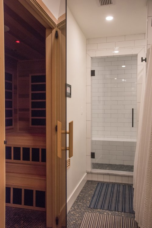 A bathroom with a sauna and a steam shower