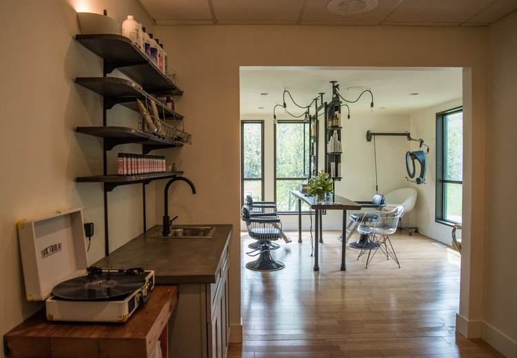 A record player is sitting on a table in a room.