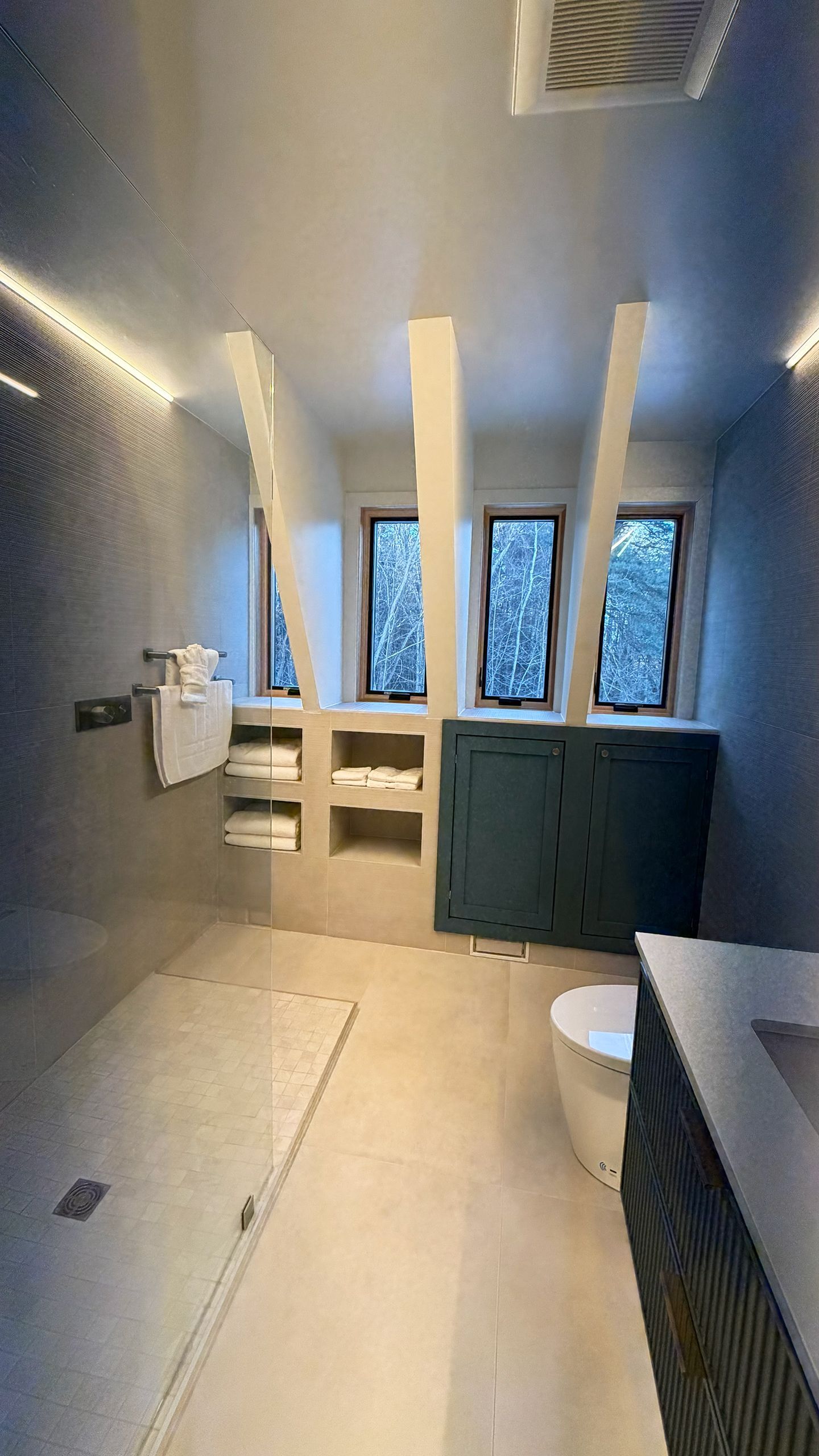 A modern bathroom with a glass-enclosed shower