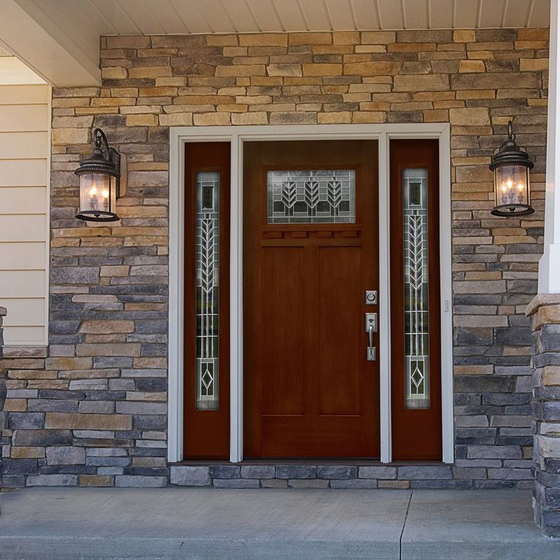 The front door of a house with a brick wall