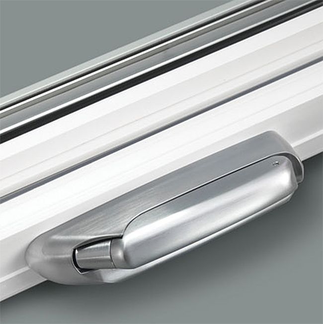 A close up of a silver handle on a window