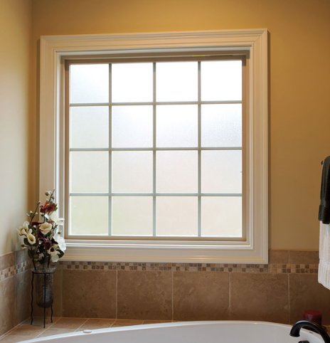 A bathroom with a large window and a tub