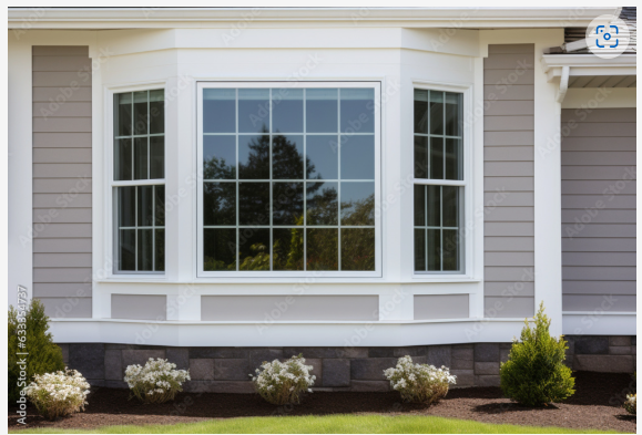 A house with a large bay window on the front of it