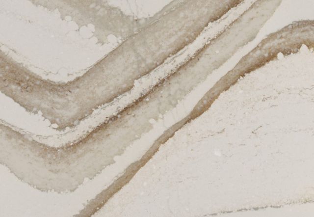White countertop with diagonal brown veining.