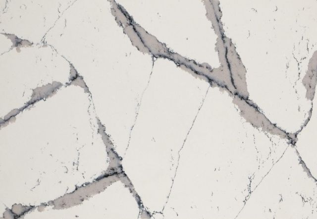 White countertop with dark gray veining.