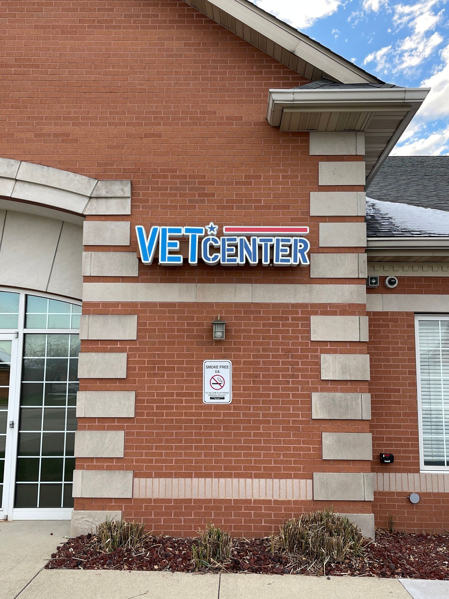 Brick building with a blue 