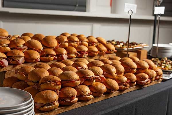 A bunch of sandwiches are stacked on top of each other on a table.