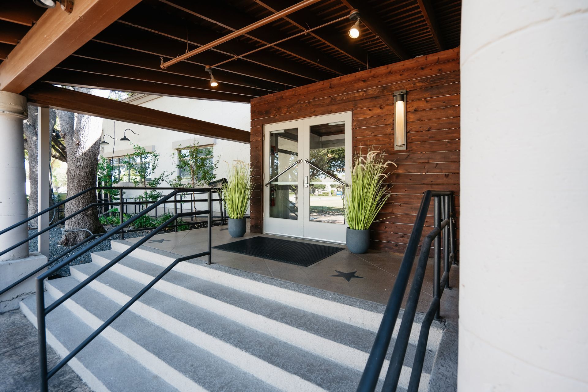 A brick building with stairs leading up to it