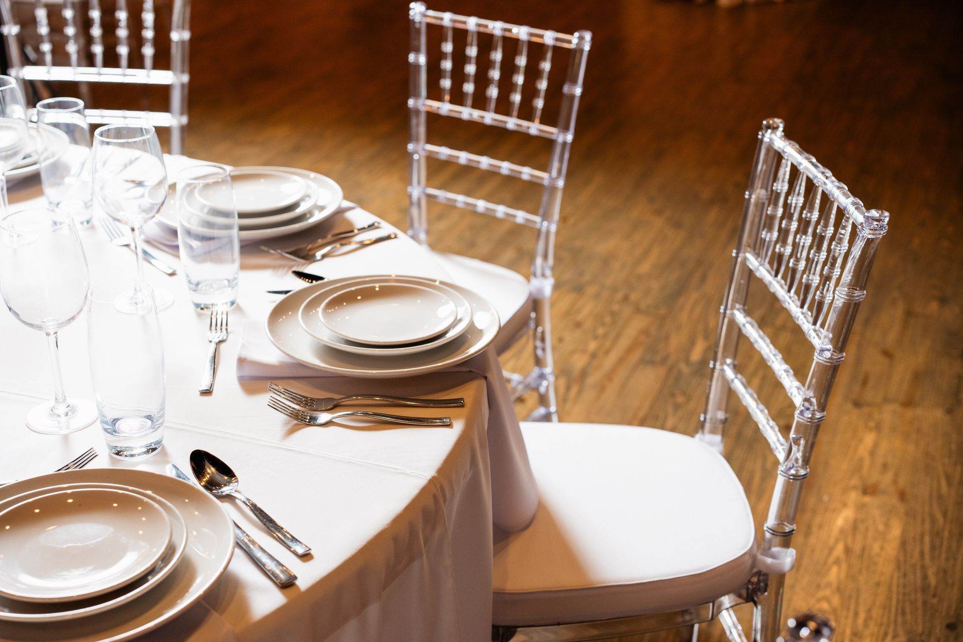 A table with plates glasses and silverware on it