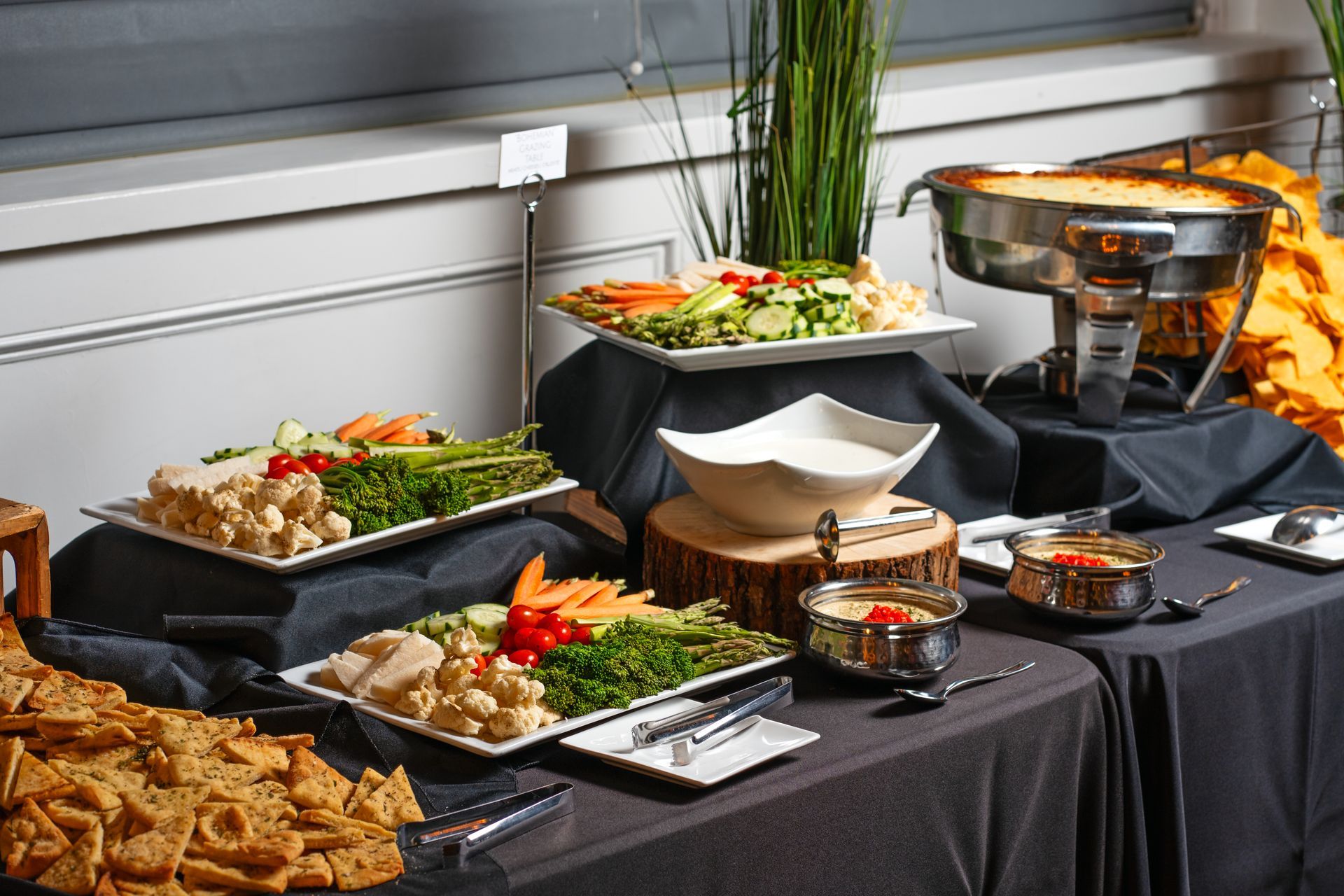 A buffet table with a variety of food on it