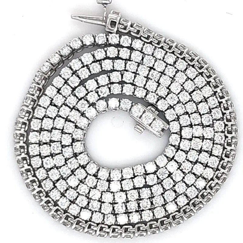 Coiled silver-toned rhinestone necklace on a white background