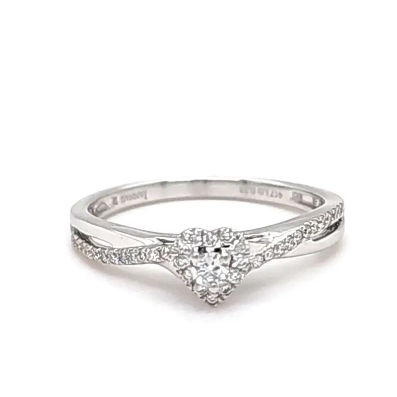Silver diamond engagement ring with a heart-shaped cluster and pavé band