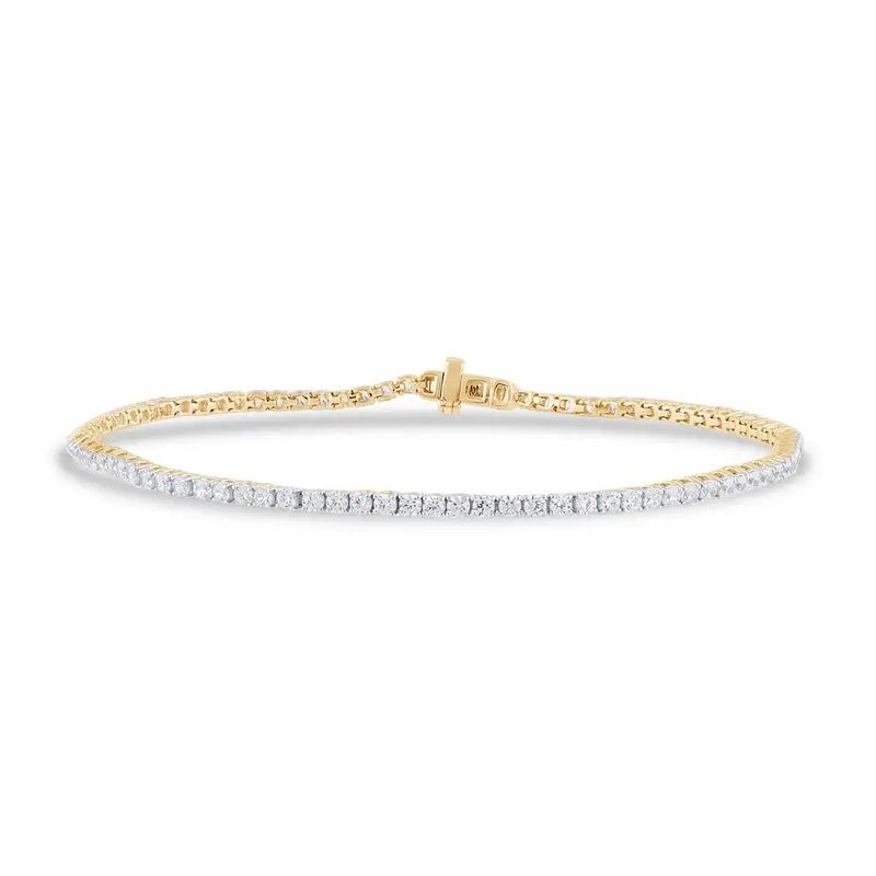 Two-tone gold and silver diamond tennis bracelet on a white background
