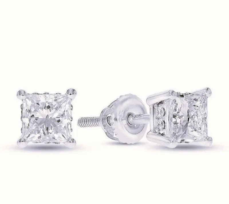 Pair of clear square stud earrings with screw-back clasps on a white background