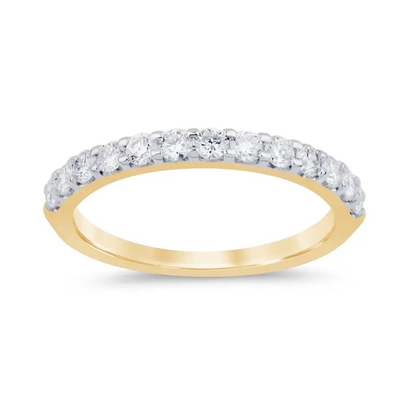 Gold ring with a row of clear gemstones on the top half