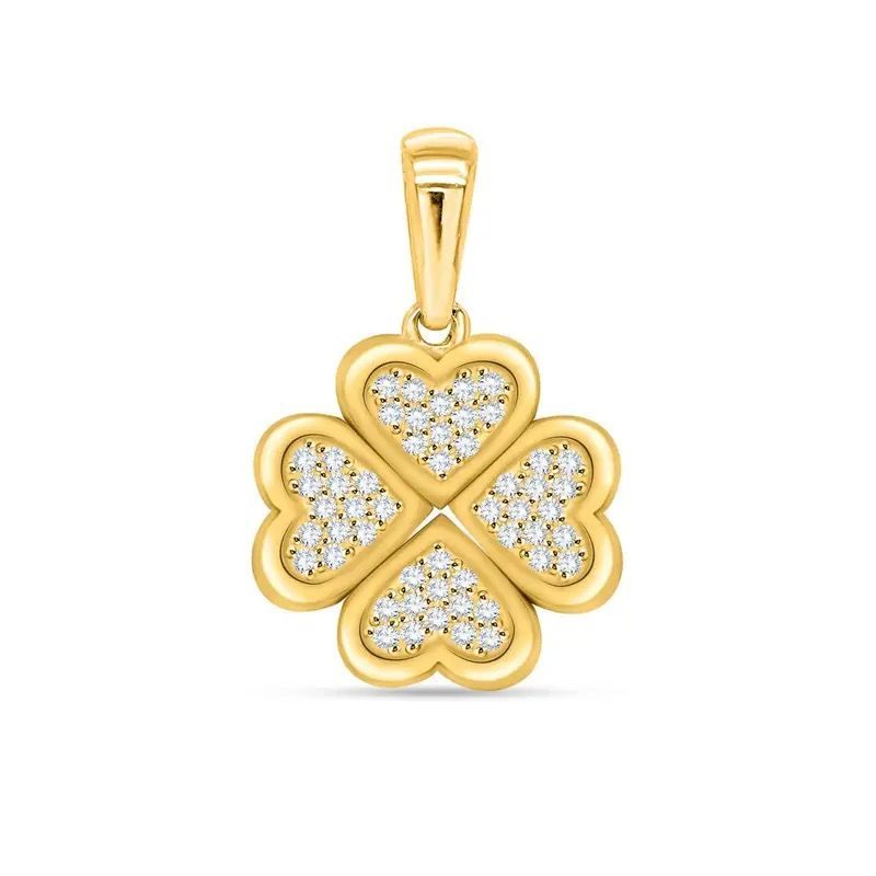 Gold four-leaf clover pendant with diamond-like stones on a bail