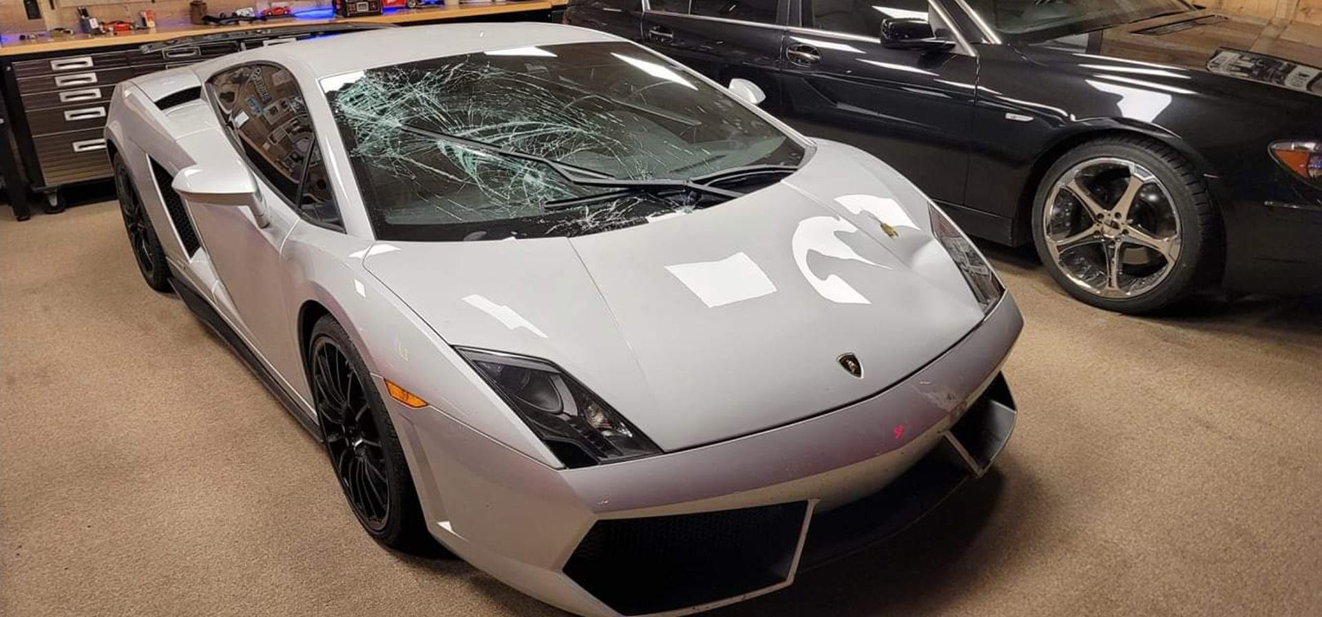 Gray Lamborghini with smashed windshield