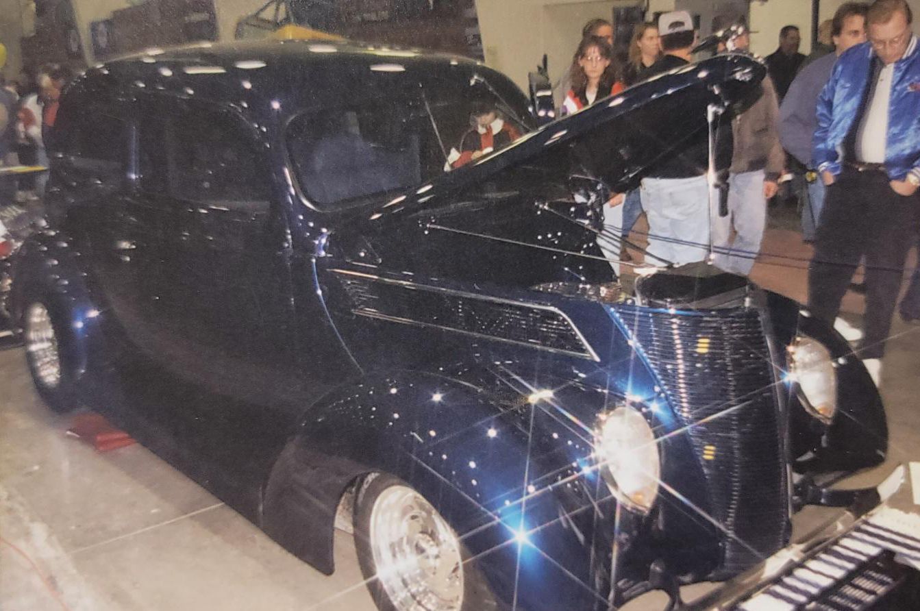 Front view of a blue vintage car