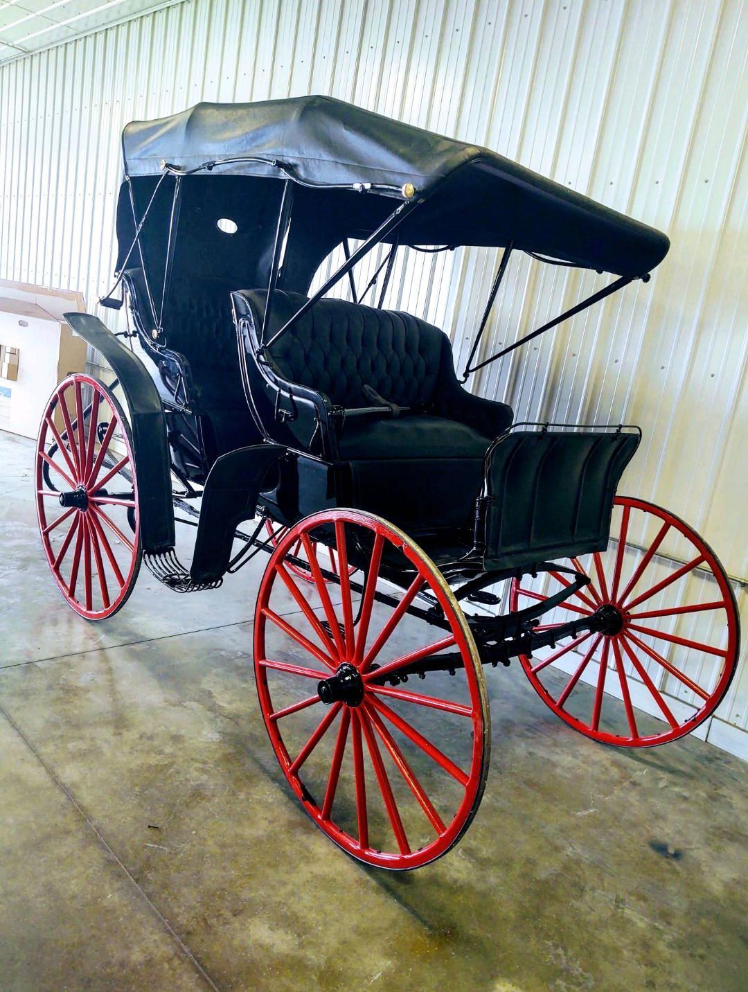 Vintage carriage with red wheels