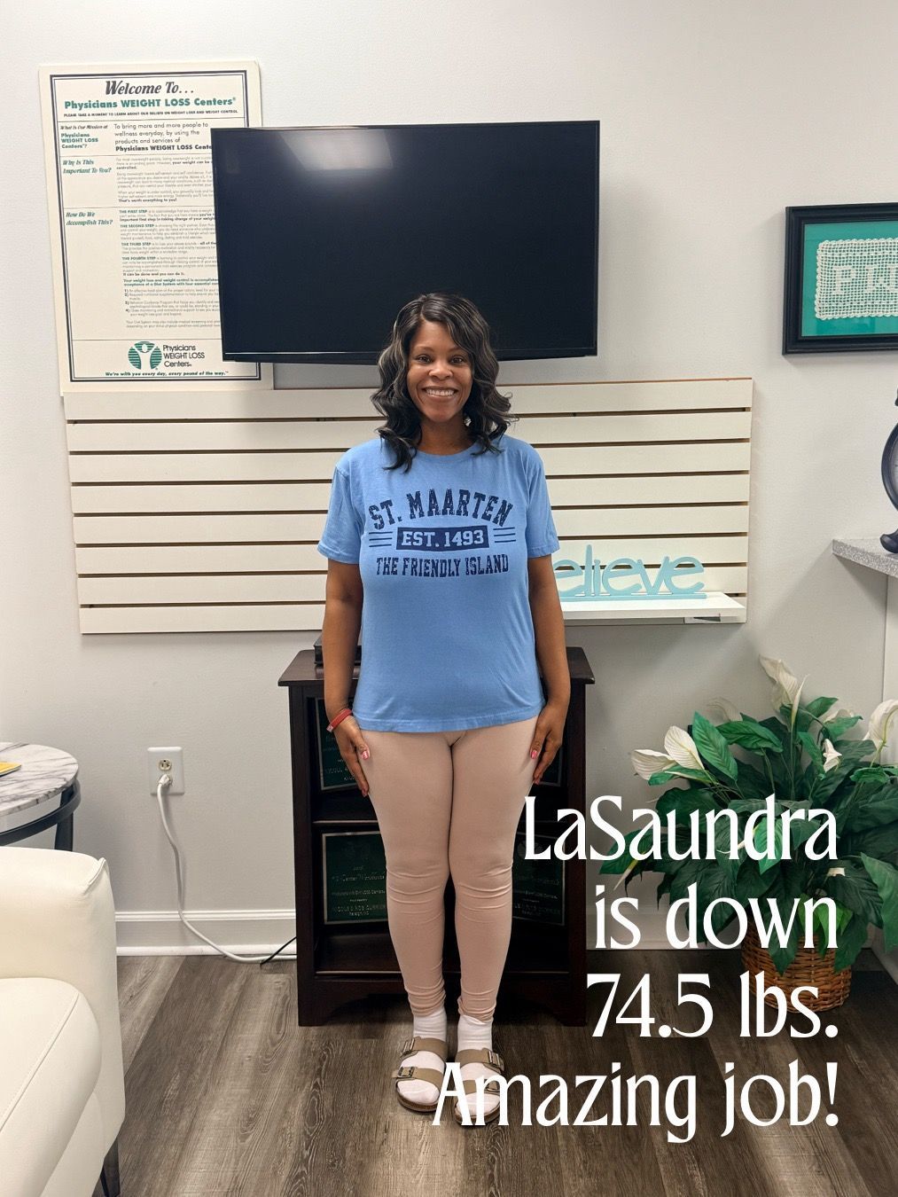 Woman in blue shirt and pink pants, standing in an office. Text says she lost 74.5 lbs.