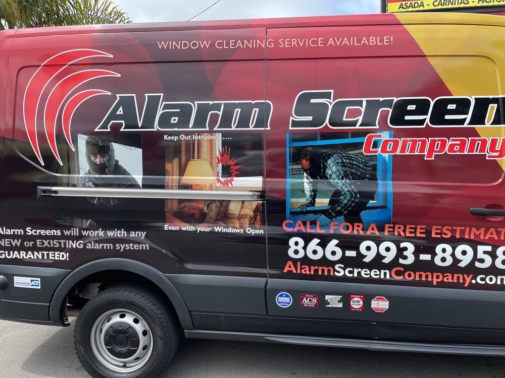 Alarm Screen Company service van with large logo and contact number on the side