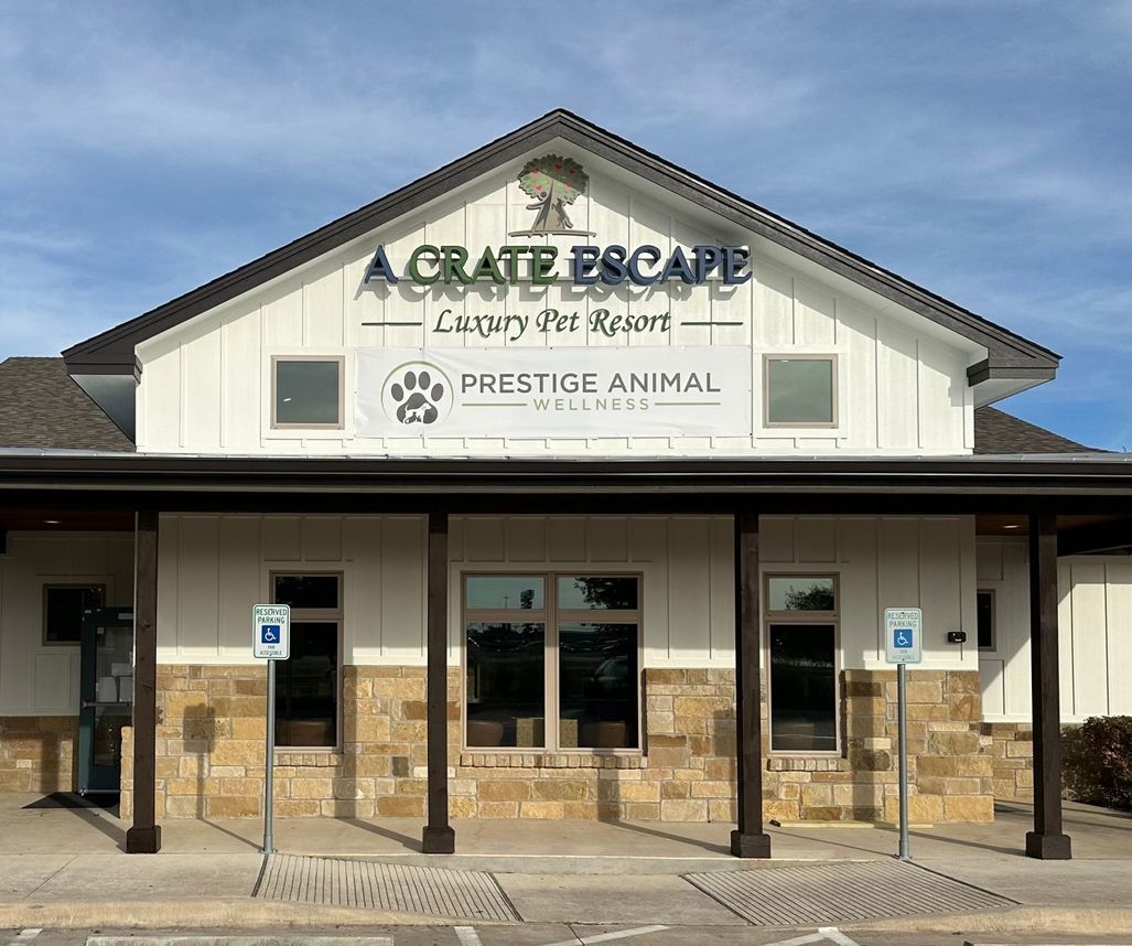 A white building with a sign that says a crate escape