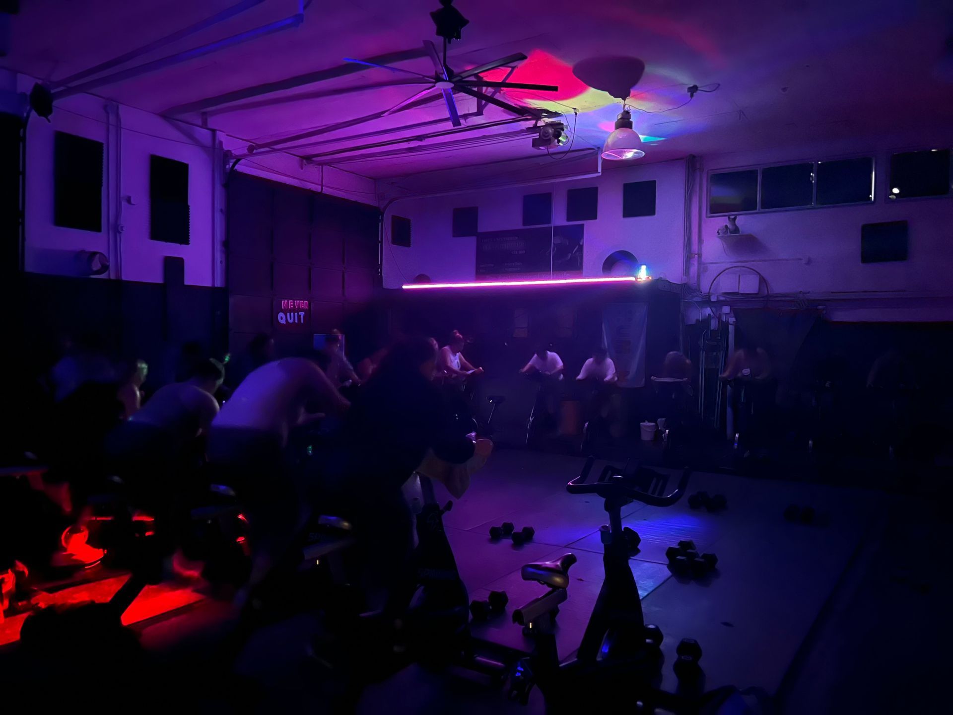 Dimly lit indoor gym with purple lighting
