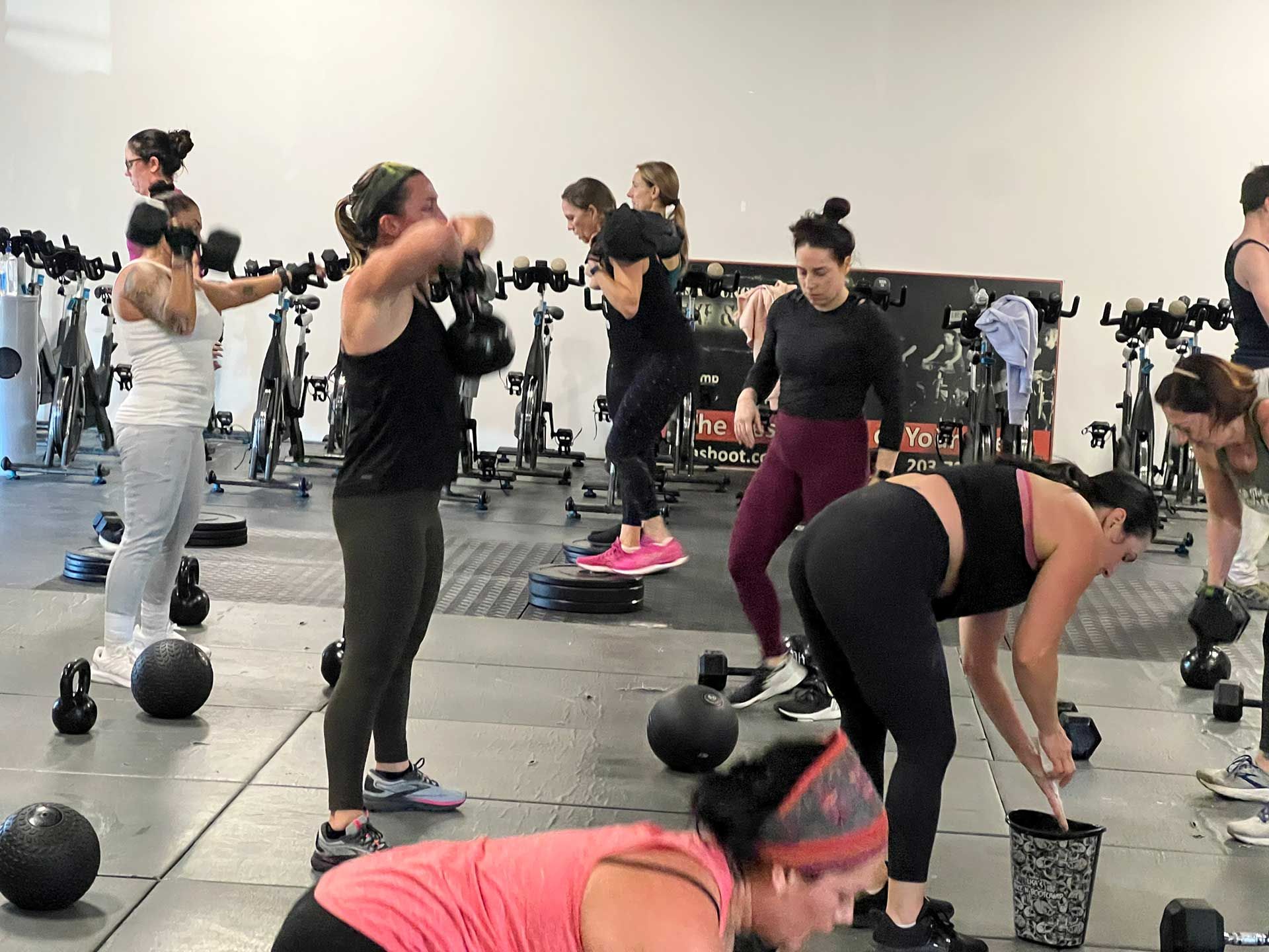A group of women are working out in a gym