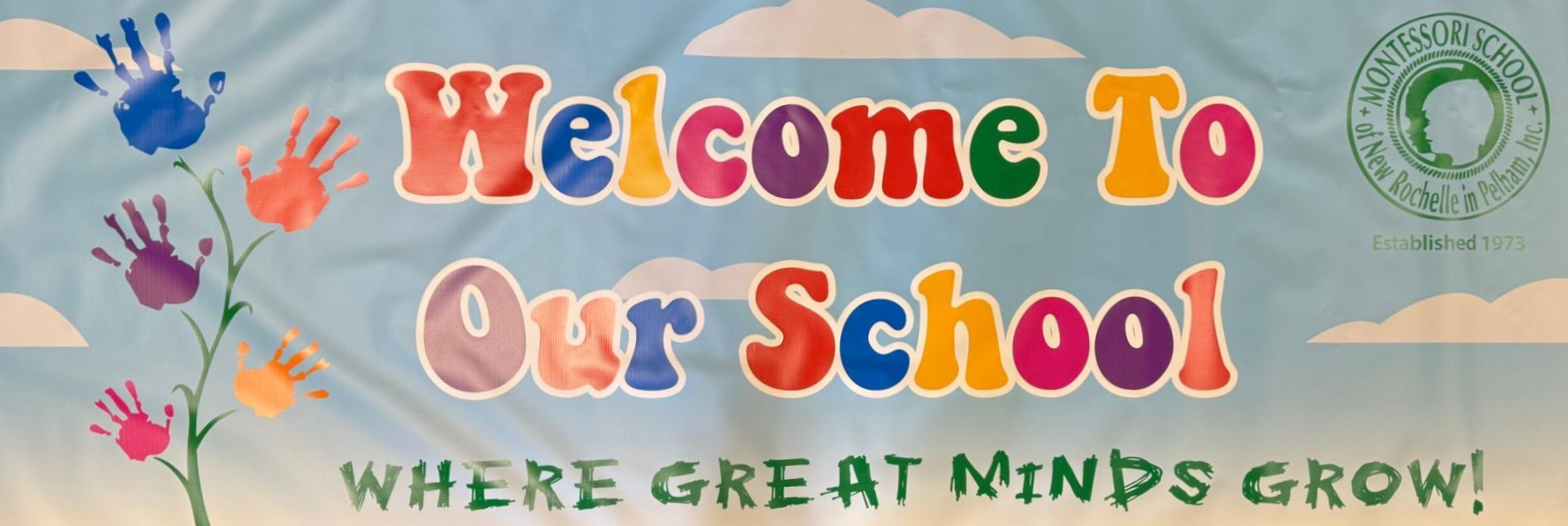 A banner that says welcome to our school where great minds grow