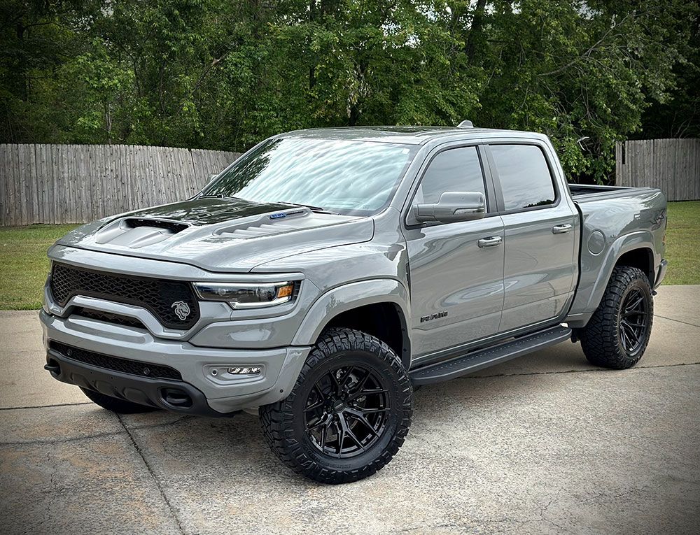 Gray Ram TRX truck with black accents, parked outdoors.