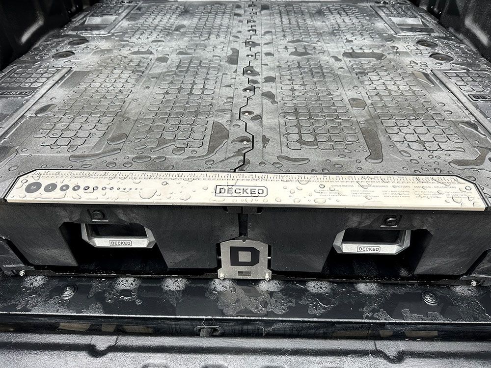 Truck bed with a Decked storage system, showing a closed top and two pull-out drawers.