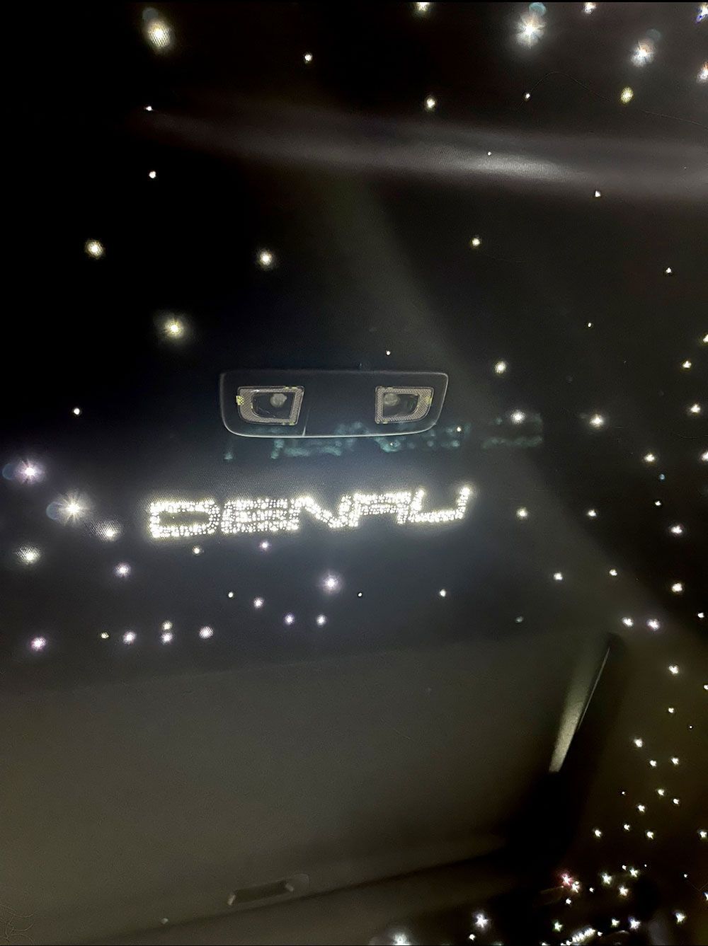 Black car ceiling with illuminated stars and 