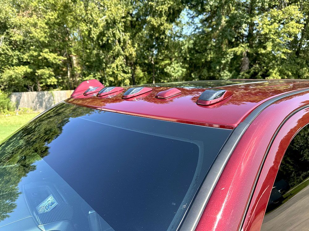 Red truck roof with cab lights.