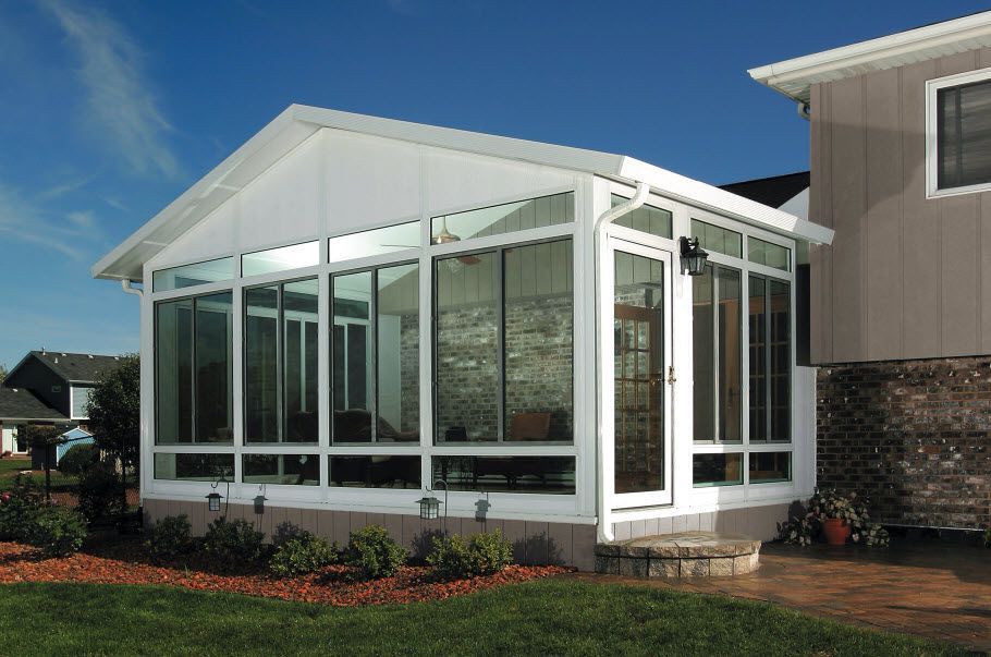 A house with a sunroom on the side of it