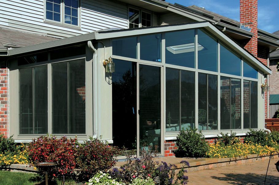 A house with a sunroom on the side of it