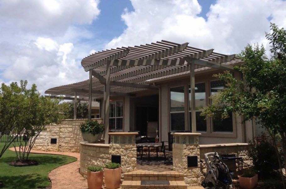 A house with a pergola on top of it