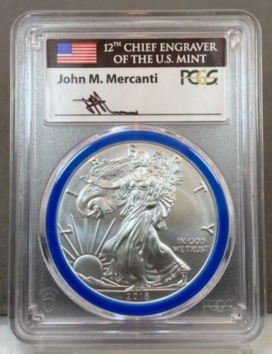 A coin in a case that says chief engraver of the u.s. mint