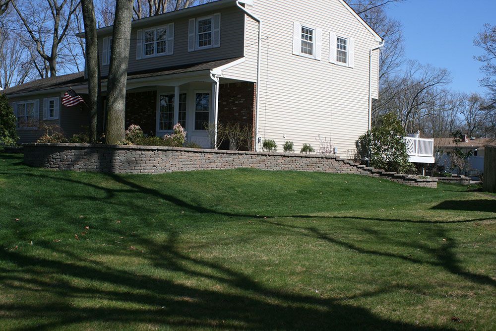 A large house with a large lawn in front of it
