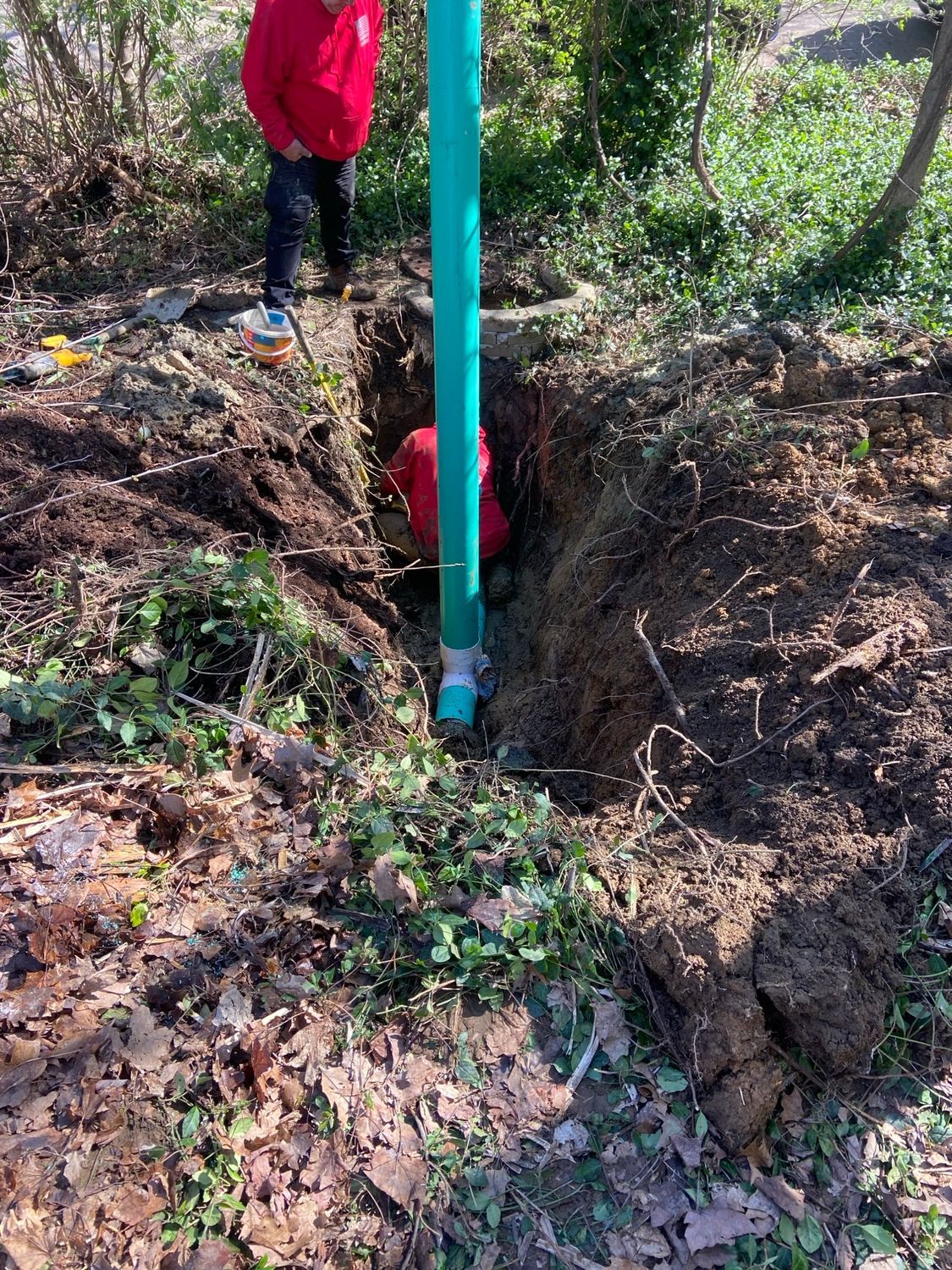 A wall with a bunch of pipes coming out of it