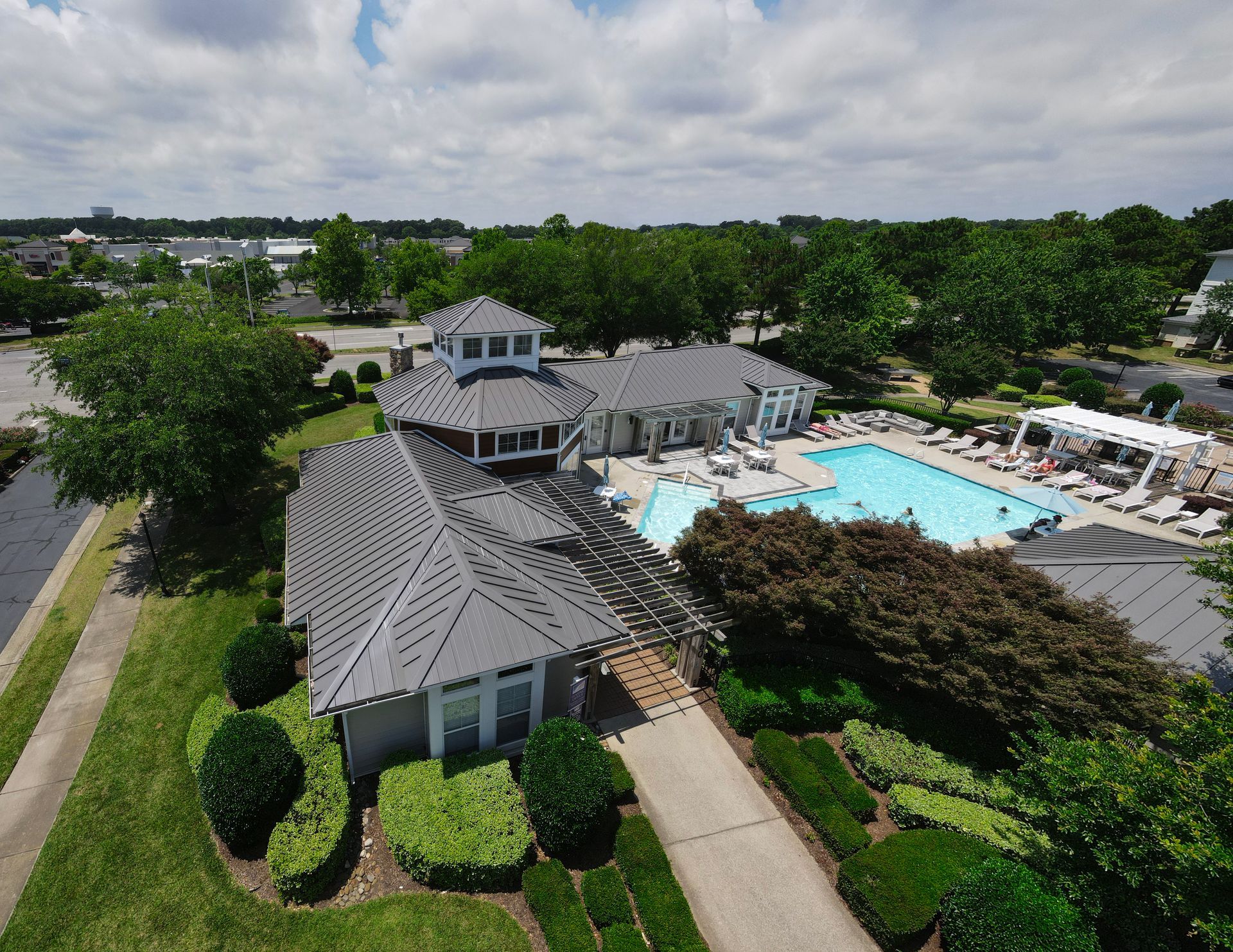 An aerial view of a house with a swimming pool