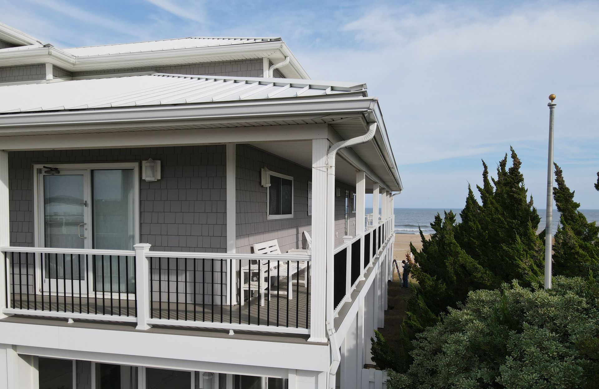 A house with a balcony overlooking the ocean
