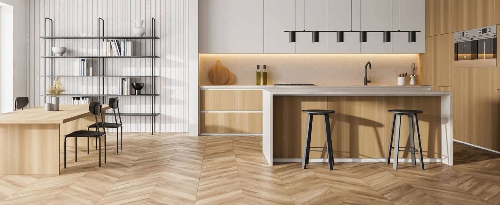 A kitchen with wooden cabinets , stools , a table and a bookshelf.