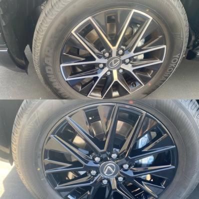 Two black alloy car wheels with silver accents, stacked one above the other, close-up view