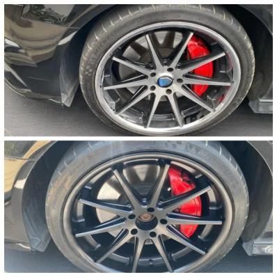 Side-by-side close-up of a black car wheel with a red brake caliper, showing two different rim designs.