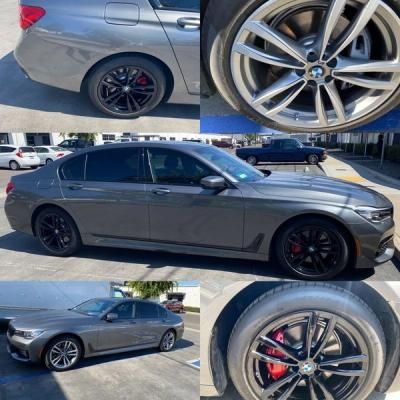 Gray BMW sedan in a parking lot, shown from side and close-ups of alloy wheels with red brake calipers.