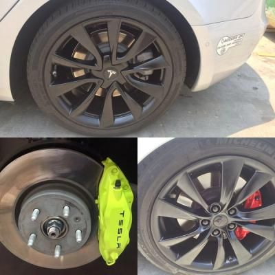 Tesla wheel with black rim and neon yellow brake caliper, plus close-up of wheel hub and brake assembly.